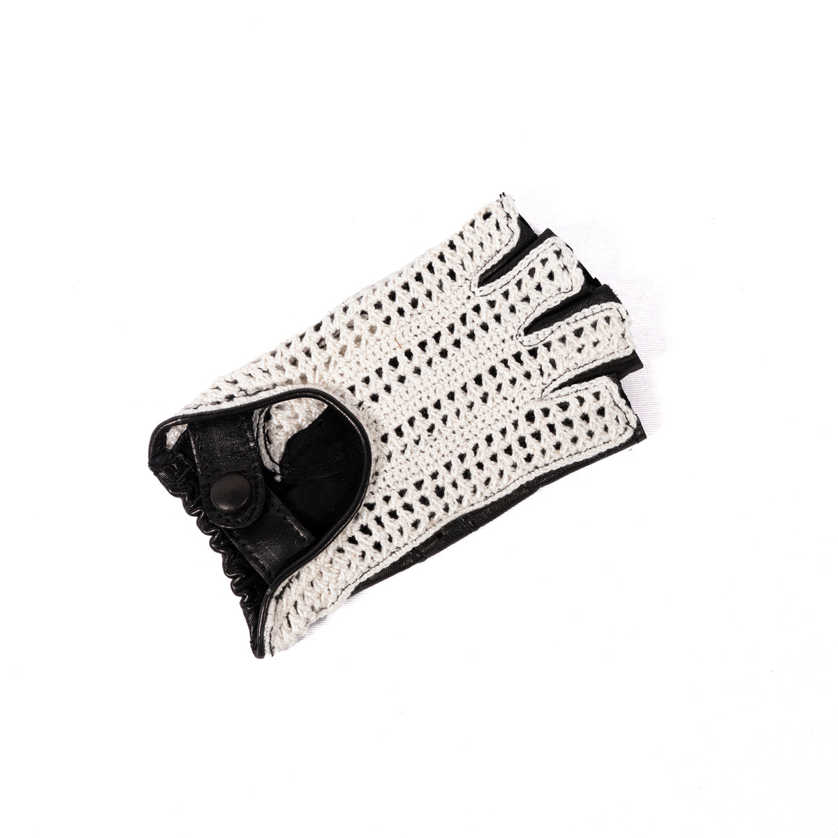 Women's black leather driving gloves with a stylish white crochet top, showcasing Italian craftsmanship and elegant design.