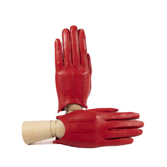 Women's unlined spring gloves in vibrant red leather, showcasing elegant stitching and a refined Italian design.