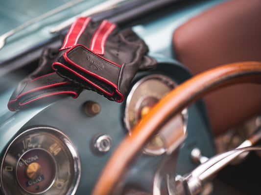 Luxury leather driving gloves in a vintage car, Gala Gloves Naples