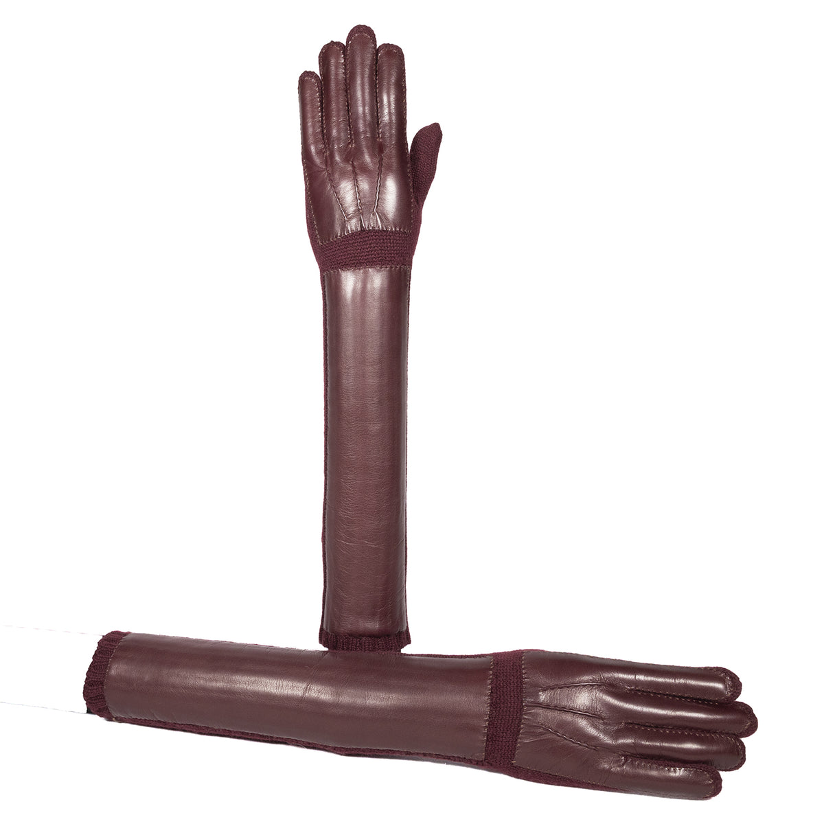 Long burgundy cashmere-lined leather gloves showcasing elegant design and Italian craftsmanship. Perfect for luxury winter styling.