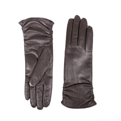 Elegant dark brown leather gloves featuring a soft cashmere lining and gathered wrist detail for a refined look.