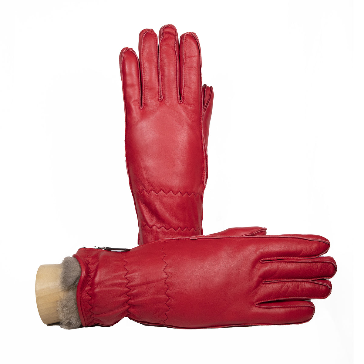 Red leather women's ski gloves featuring a plush lining and elegant stitching for a stylish winter accessory.