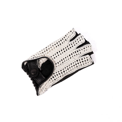 Women's black leather driving gloves with a stylish white crochet top, showcasing Italian craftsmanship and elegant design.