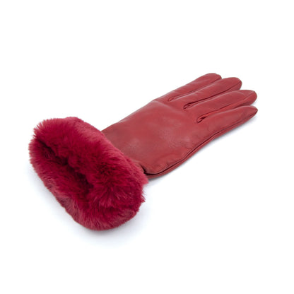 Women's red nappa leather gloves featuring a plush faux fur cuff, showcasing elegant Italian craftsmanship and luxurious design.