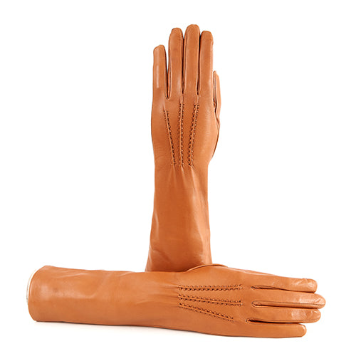 Elegant cognac nappa leather gloves with cashmere lining, showcasing refined stitching and a sleek silhouette.