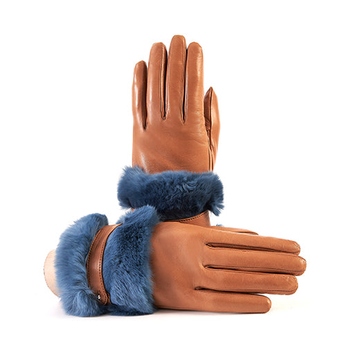 Ladies' tan nappa leather gloves featuring a large blue fur cuff and strap, lined with soft cashmere for added warmth.