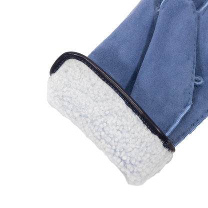 Men's blue curly lambskin gloves featuring a soft shearling lining and refined leather piped edge for elegant warmth.