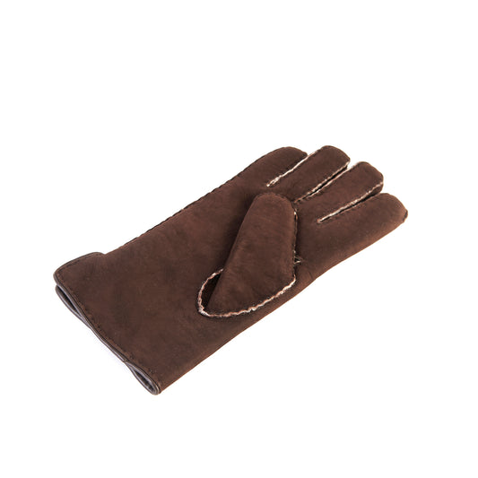 Men's brown curly lambskin gloves featuring a leather piped edge and side opening, showcasing Italian craftsmanship and elegance.