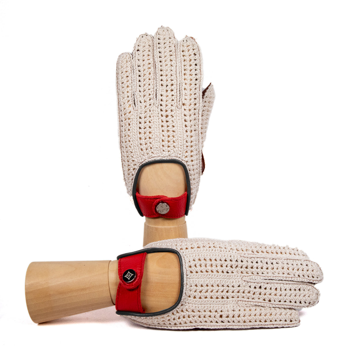 Men's cognac leather driving gloves with crochet top and red deerskin strap, showcasing Italian craftsmanship and elegant design.