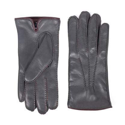 Men's hand-stitched gray nappa leather gloves featuring a rich cashmere lining and contrasting burgundy stitching.