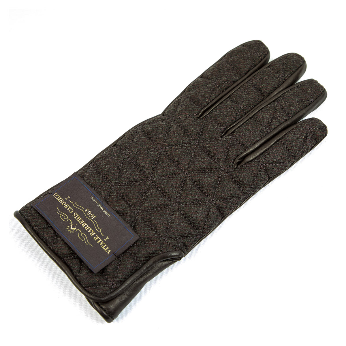 Quilted dark fabric and nappa leather gloves showcasing Italian craftsmanship and elegant design.